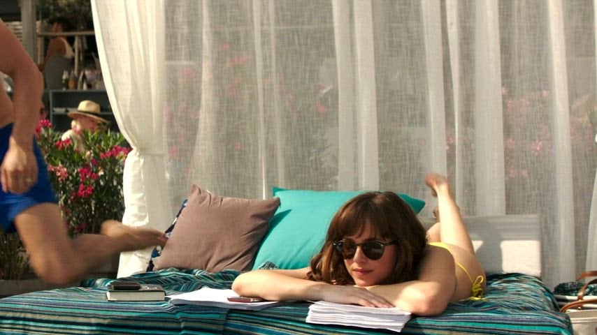 Dakota Johnson Goes Wild in a Sexy Poolside Moment