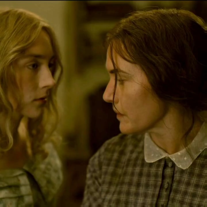 Saoirse Ronan and Kate Winslet heat things up in a steamy nude scene.